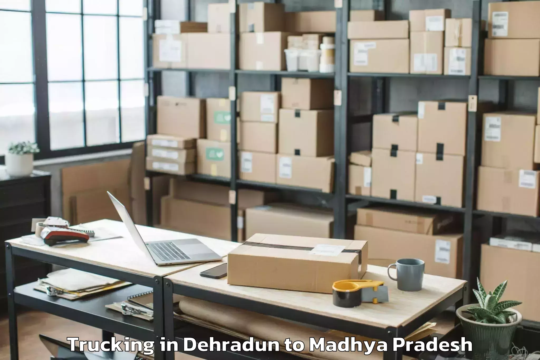 Book Dehradun to Pipariya Trucking